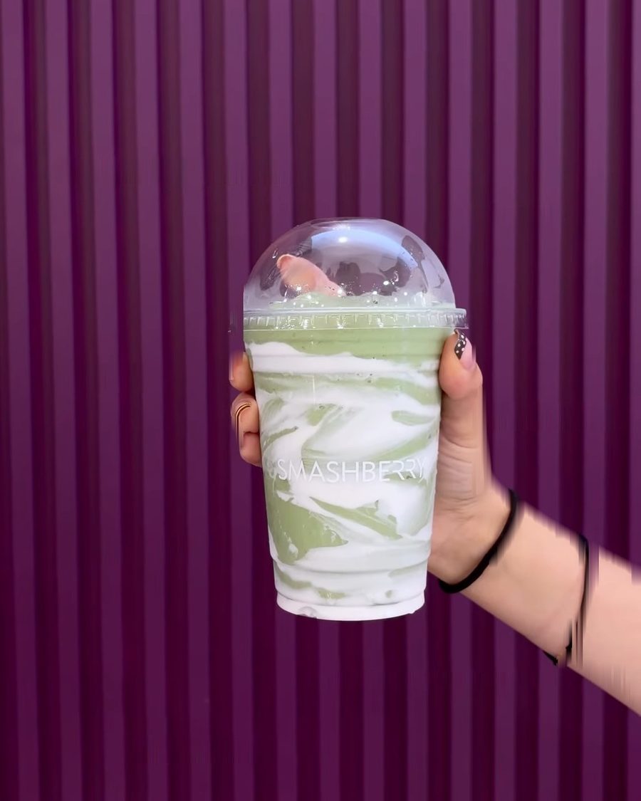 Inner Glow smoothie, soft green swirled with white under a domed lid.