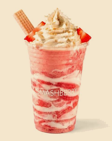 Strawberry Shortcake dirty smoothie, pink and white, whipped cream and a wafer.