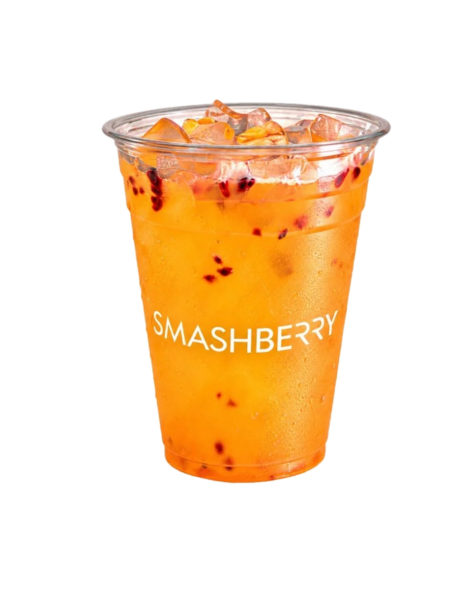 Passion Fruit refresher, orange, with red fruit seeds, Smashberry cup.