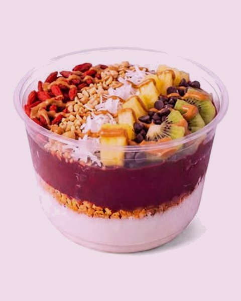 A build-your-own bowl: kiwi, mango, coconut and granola on the açaí base.