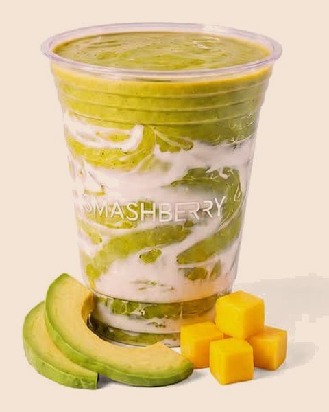 Inner Glow smoothie, swirled green, with avocado and mango.
