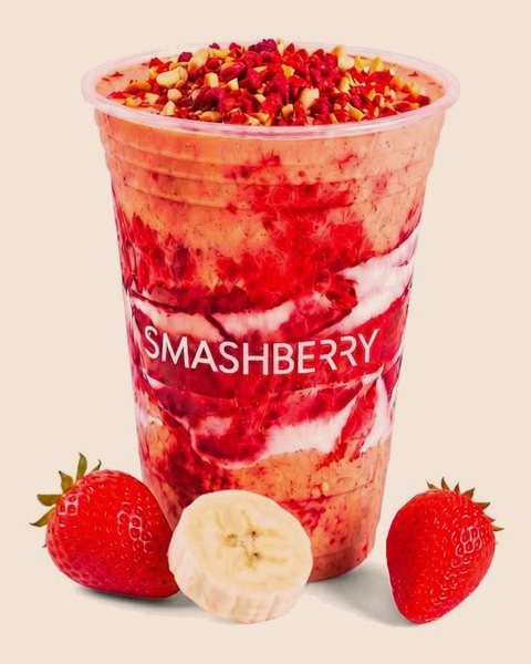PB Jammin’ smoothie, swirled strawberry red, with strawberries and banana.