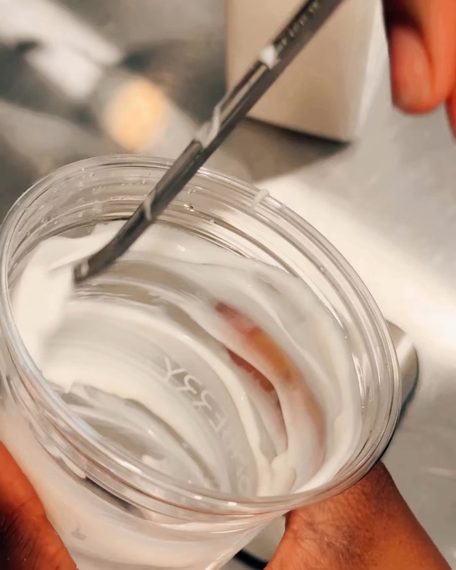Yogurt spread inside the cup before the smoothie.